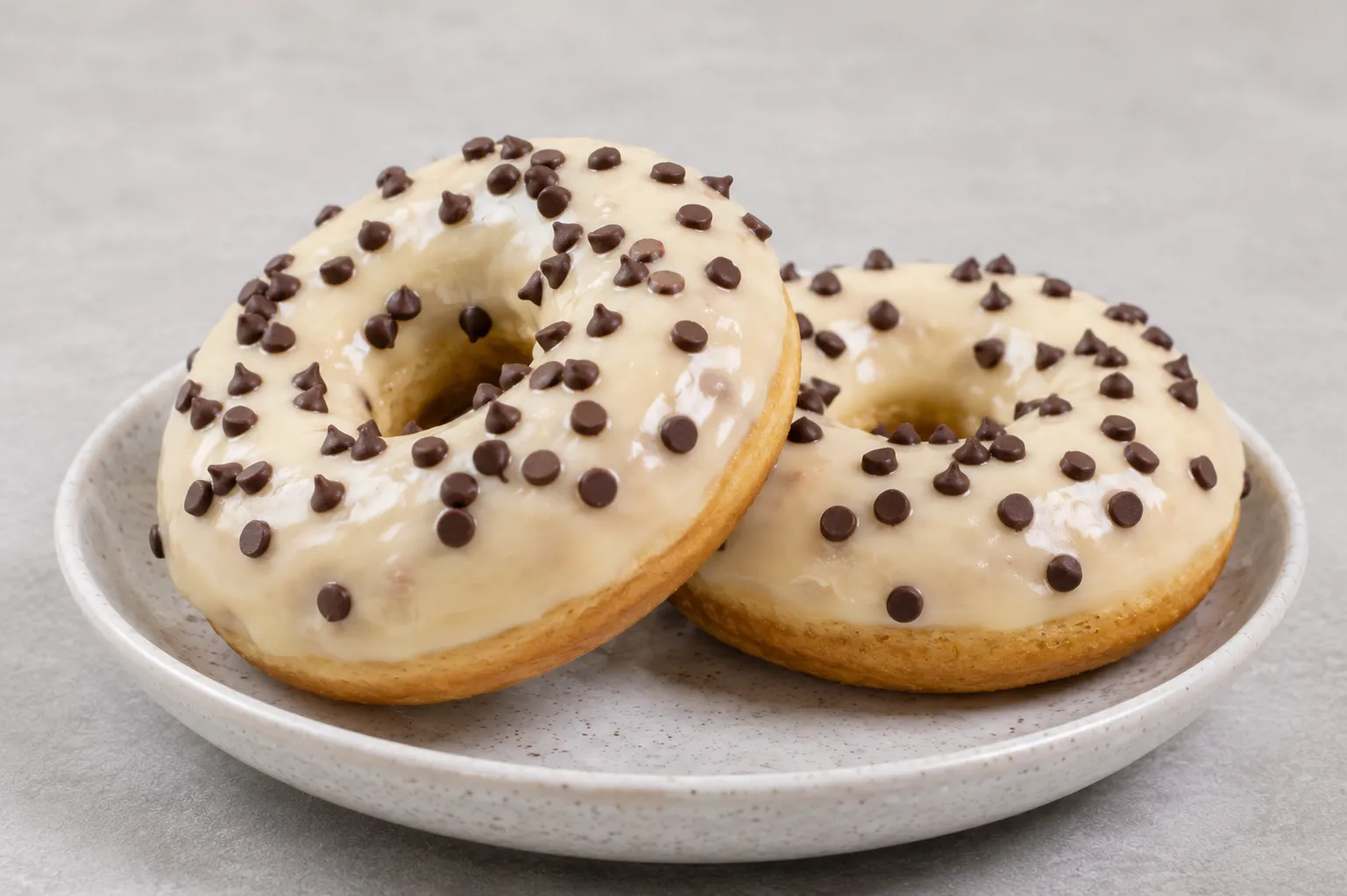 protein donuts with vanilla dip and choco chip toppings
